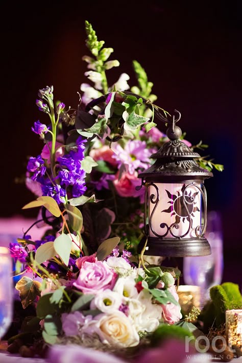 Tangled inspired wedding centerpiece at an Epcot wedding in The Living Seas Salon.  #tangled #tangledwedding #rapunzel  #root_weddings #livingseas #thelivingseas #disneywedding #disneyweddingphotographer #orlandoweddingphotographer Fairytale Wedding Centerpieces, Rapunzel Sweet 16, Tangled Wedding Theme, Tangled Prom, Tangled Sweet 16, Tangled Inspired Wedding, Tangled Themed Wedding, Tangled Quince, Rapunzel Quince