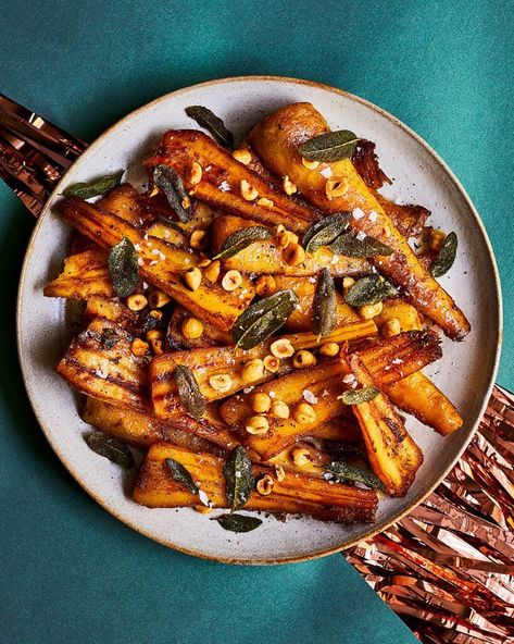 Butter-roast parsnips with hazelnuts and sage Winter Vegetable Dishes, Carrot Parsnip Roasted, Christmas Parsnip Recipes, Christmas Parsnips, Parsnips Recipe Roasted, Witch Foods, Christmas Crisp, Vegetarian Roast Dinner, French Huguenots