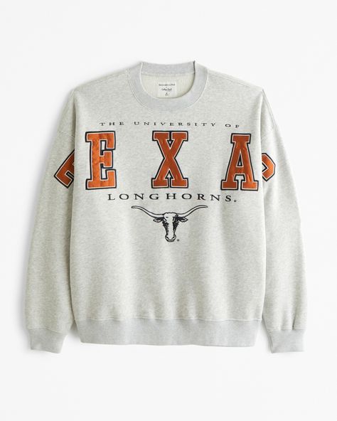 Classic sweatshirt in our softAF fleece fabric and oversized-fit silhouette, featuring University of Texas-inspired graphic detail at chest and sleeves, crew neckline and banded hem and cuffs. Vintage High School Sweatshirt, Vintage College Crewneck, College Merch Ideas, Male Design, Texas Graphic, Cute Crewneck Sweatshirt, Skort Dress, Male Style, Classic Sweatshirt