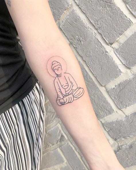 Minimalist Buddha tattoo by Loz Thomas inked on the left forearm Small Buddhist Tattoo, Buddhism Tattoo, Buda Tattoo, Buddhist Tattoo, Buddha Tattoo Design, Cool Wrist Tattoos, Buddha Tattoos, Forarm Tattoos, Little Buddha