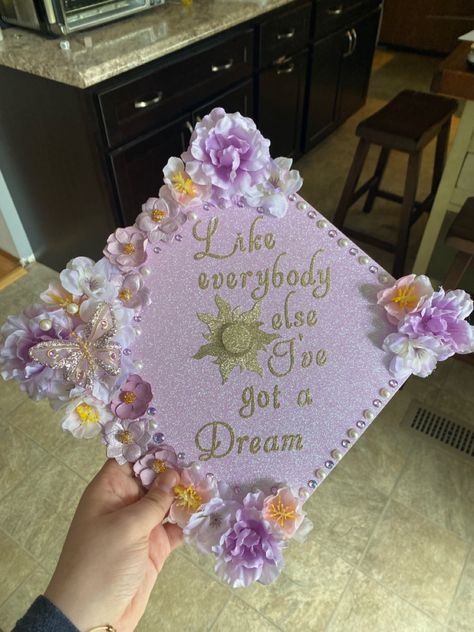 Cap Decoration Graduation Princess, College Hats Graduation Caps, Slipping Through My Fingers Grad Cap, Star Grad Cap Ideas, Repunzle Graduation Cap, Grad Caps With Bows, Grad Cap Ideas Business Major, Extra Graduation Cap, Grad Cap Designs Tangled