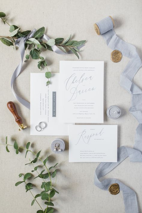 Dusty blue detail shot including eucalyptus greenery, Minted invitations, engagement ring, and earrings  PC Sidney Leigh Photography Dusty Blue Detail Shots, Blue Wedding Flatlay, Dusty Blue And Greenery Wedding, Minted Invitations, Invitations Engagement, Wedding Detail Shots, Mood Wedding, Blue White Weddings, Holy Matrimony