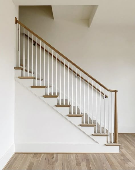 Wood Railing With Black Spindles, Tapered Stair Spindles, Cottage Banister, Wood Stair Railing Ideas Farmhouse, Banisters And Railings Makeover Wood, Wooden Stair Banister, All Wood Stairs, Modern Banisters And Railings Wood, White Oak Railing