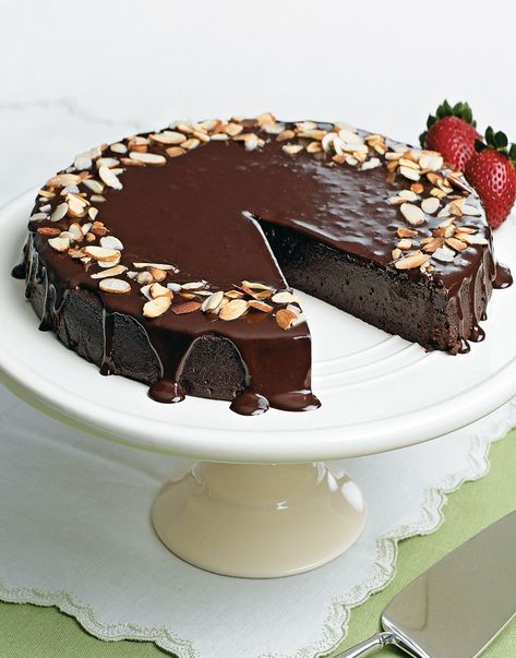 Chocolate-Almond Torte with Ganache Topping | With elegant good looks, creamy texture, sophisticated taste, and simple instructions, this is one chocolate dessert that will leave you with plenty of good cheer. Even better, this five-star Chocolate-Almond Torte is also a great make-ahead dessert. #cuisineathome #cakerecipes #bakingrecipes #dessertrecipes #cakes #cakeideas #food #recipe #chocolate #chocolatedesserts #desserts #dessertrecipes Chocolate Almond Desserts, Chocolate Almond Torte, Chocolate Torte Recipe, Cake Garnish, Mini Peach Pies, Almond Torte, Simple Chocolate Cake, Cake Almond, Chocolate Almond Cake