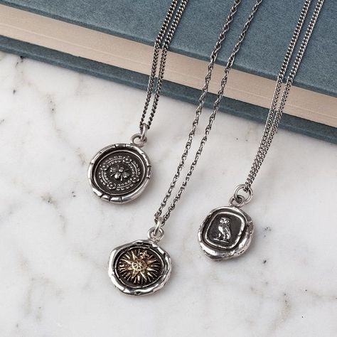 Three sterling silver Pyrrha talismans are displayed laying over a slate color hardcover book. Guy Jewelry, Art Clay Silver, Stamped Necklaces, Witch Jewelry, Dope Jewelry, Carbon Neutral, Minimal Jewelry, Funky Jewelry, Jewelry Lookbook