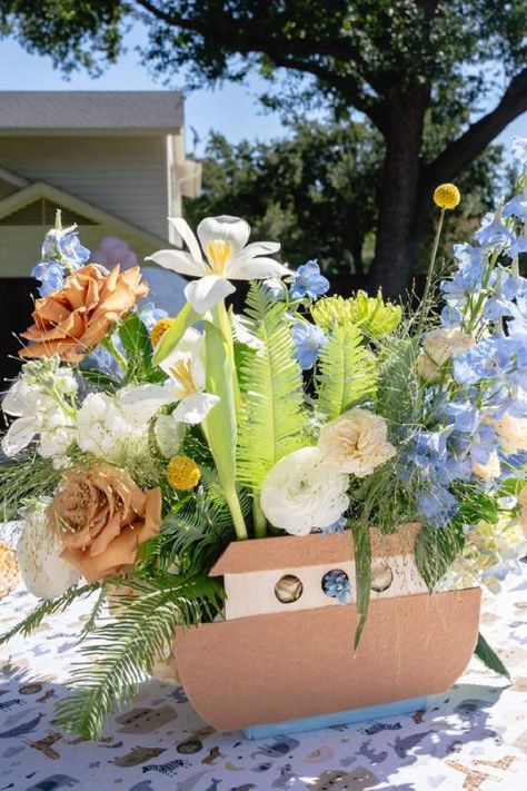 Feast your eyes on this stunning Noah's ark-themed baby shower! The floral centrepiece is wonderful!! See more party ideas and share yours at CatchMyParty.com Noahs Ark Shower Ideas, Noah’s Arch Theme Birthday, Noahs Arc First Birthday, Noahs Ark Party Theme, Noah's Ark Party Decorations, Noah’s Ark First Birthday, Noah's Ark Baby Shower Decorations, Noahs Ark Centerpiece Ideas, Noah’s Ark Decorations