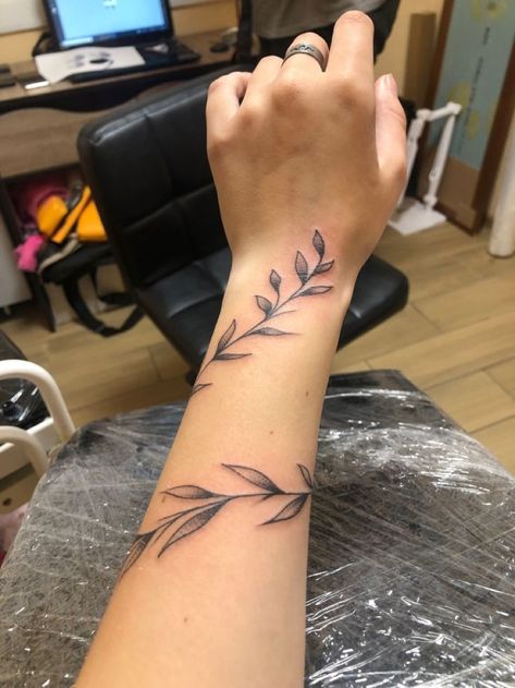 Rap Around Vine Tattoo, Leaf Wrap Around Tattoo Arm With Butterfly, Vine Wrist Wrap Tattoos For Women, Rap Around Vine Tattoo Arm, Barb Wire Forearm Tattoo, Leaf Wrap Around Tattoo Forearm, Fine Line Leaves Tattoo Arm, Leaf Wrapped Around Arm Tattoo, Dainty Vine Tattoo Arm