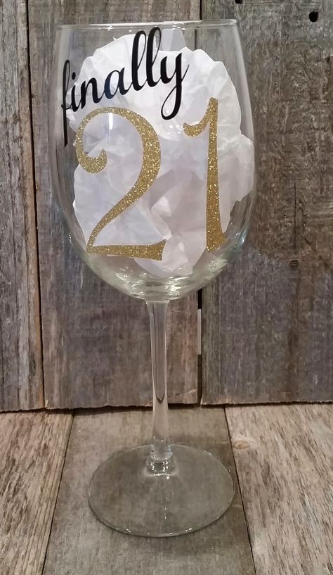 Turning 21 is a much bigger (and blingier) deal now than it was when I turned 21 a few years ago. I have decorated wine glasses as well ... Party Ideas 21st Birthday, 21st Birthday Crafts, Cricut Wine Glasses, 21 Birthday Wine Glass, Birthday Wine Glasses, Wine Glass Sayings, 21st Birthday Presents, Turning 21, Trendy Water Bottles