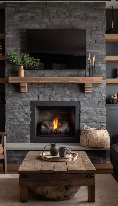 Fireplace Step Decor, Gas Fireplace With Seating Ledge, Dark Boho Living Room Ideas, Charcoal Gray Fireplace Brick, Slate Stacked Stone Fireplace, Fake Stone Wall Living Room, Fireplace Mantle Renovation, Stone Fireplace With Shelves On Side, Dark Grey Stone Fireplace