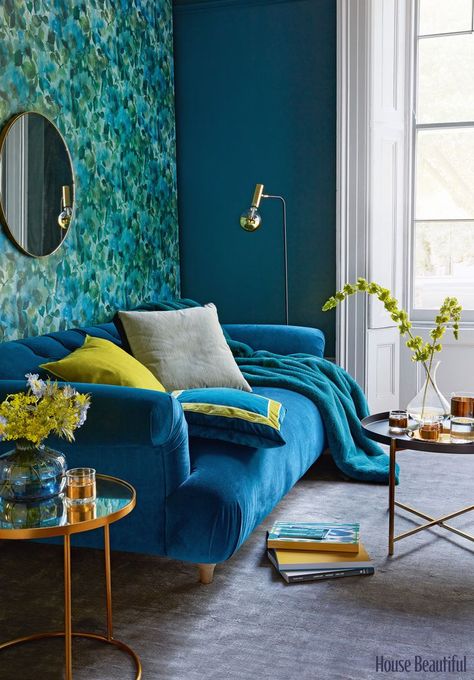 A painterly floral wallpaper provides a delicate backdrop to a beautiful deep-blue velvet sofa. For the perfect finishing touch, add velvet cushions with a contrasting trim. (Styling: Lorraine Dawkins. Styling Assistant: Amy Neason. Photography: Tim Young) #livingroomideas Teal Living Room Decor, Teal Living Rooms, Minimalist Living Room Decor, Blue Velvet Sofa, Velvet Style, Living Room Color Schemes, Trendy Living Rooms, Room Color Schemes, Living Room Scandinavian