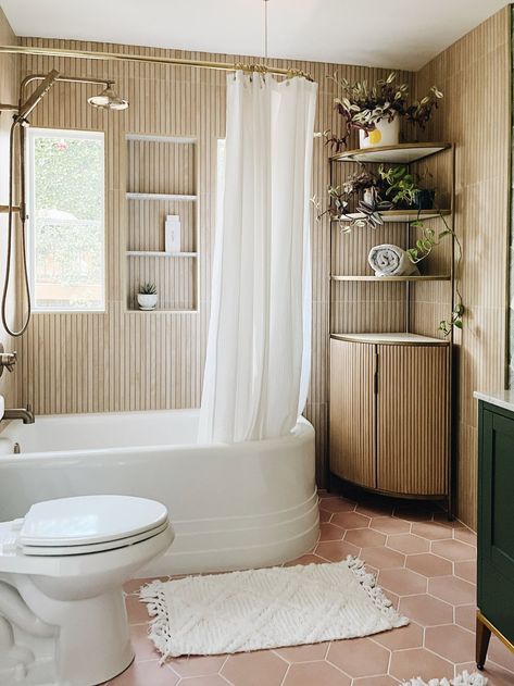 Northwest Interior Design, Wood Slat Accent Wall, Slat Accent Wall, Shower Combo, Shower Tub Combination, Accent Wall Ideas, Small Bathroom Organization, Corner Tub, Unique Shower Curtain