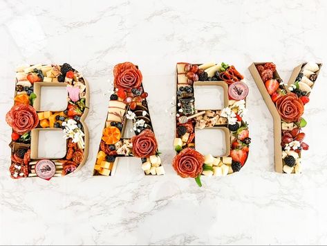 Word Charcuterie Board, Letter Shaped Charcuterie Board, Letter Food Tray Ideas, Baby In Bloom Charcuterie Board, Fall Baby Shower Charcuterie Board, Baby Letter Charcuterie Board, Charcuterie Board Gender Reveal, Baby Shower Brunch Ideas Food, Letter Food Tray