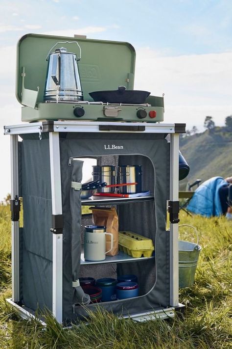 Something about this screams ID Student Project, but this object is actually on the market. This is a fold-flat cabinet for camping or tailgating. The briefcase-like form unfolds to provide a 31.5" high surface, with shelves inside to store your foodstuffs.  While the designers went with aluminum rails in order to save weight, they—unwisely, in my opinion—opted for MDF for the tabletop and shelves. At nearly 18 pounds in weight overall, that puts this object firmly in the car camping category. Camping Gear Organization, Cool Camping Gear, Flat Cabinets, Outdoor Organization, Camping For Beginners, Camp Gear, Camping Set Up, Road Travel, Best Camping Gear