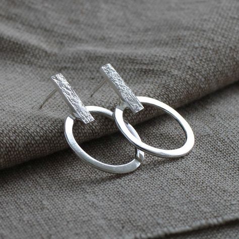 Reflections earrings. Light to wear and the ring moves subtly when worn. Handmade with either a hammered or stone texture. Which would you choose? ♻️ All my jewellery is made completely from 100% certified recycled silver Modern Silver Earrings, Wire Jewelry Earrings, Huggie Earrings Silver, Handmade Silver Jewellery, Metalwork Jewelry, Contemporary Earrings, French Jewelry, Silver Jewelry Design, Silver Jewellery Sets