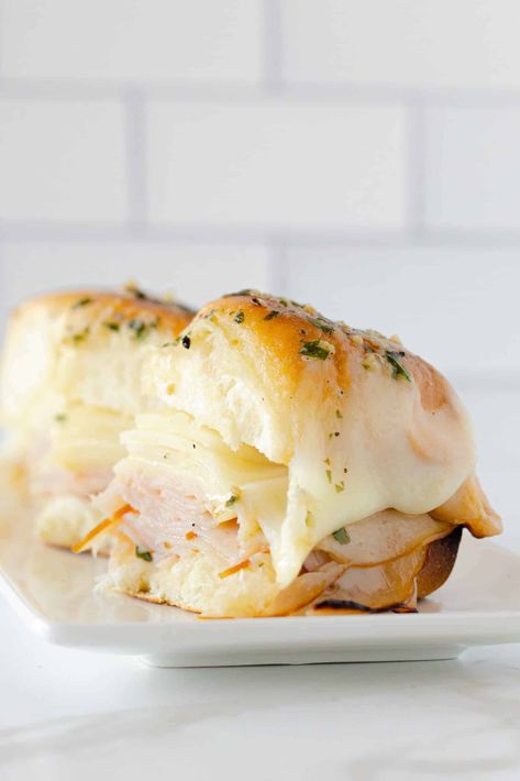 These Easy Turkey Sliders with a Butter Sauce are super tasty, can be made in minutes, and is perfect for a crowd! This amazing Turkey Slider is made with an herb garlic butter and served with melted provolone cheese. It's ready in under 30 minutes and makes a delicious meal! Easy Turkey Sliders, Provolone Cheese Recipes, Sliders Recipes Turkey, Gluten Free Recipes Appetizers, Michigan Food, Turkey Sliders, Slider Sandwiches, Griddle Recipes, Turkey Cheese