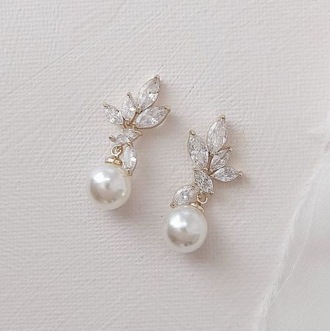 Exquisitely crafted, these luminous pearl drop bridals earrings will  illuminate your look. Featuring cubic zirconia stones in a leaf-like arrangement and finished with a lustrous creamy pearl. Details Length 3cm Width 1.2cm All our jewellery comes perfectly packaged in our custom jewel box. Pearl Drop Bridal Earrings, Pearl Drop Earrings Wedding, Drop Bridal Earrings, Bridal Drop Earrings, Pearl Drop Earrings Bridal, Teardrop Bridal Earrings, Bridal Earrings Studs, Bridal Statement Earrings, Pearl Drop Earrings Gold