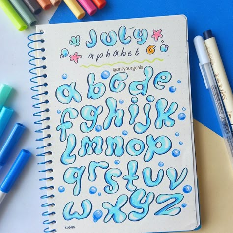 🐠July aphabet: Water bubbles Edition!💦 Full page water bubbles aphabet - lettering of July ! Add a dynamic touch to your bullet journal this July. 🐠🌊 . Wish you all have a nice day!🐠💙 👉 Follow @tintyourgoals to follow more💙 . . . Tag🏷💛⁣ #tintyourgoals #hellojuly #bujoreels #bulletjournal #bujo #julybulletjournal #julybujo #underthesea #bujoinspiration #letteringtutorial #waterbubblesfont #julyheaders #lettering #bulletjournallettering #bujolettering #bulletjournalcommunity #bujoforbeginn... Water Fonts Alphabet, July Bullet Journal Ideas, Ocean Letters, Ocean Font, Lettering Notes, March Bujo, July Bullet Journal, Presentation Ideas For School, Water Quotes