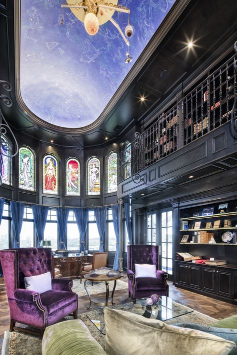 Purple wingback chairs and a pea-green sofa contrast with the rich dark wood cabinetry in this home library and music room. This project has many unique highlights: telescope observatory, music room, record listening room, starry night sky library ceiling mural, and a custom orrery fixture and much more. Telescope Room Ideas, Library With Telescope, Library Waiting Room Shifting, Ilvermorny Common Rooms, Observatory Library, Waiting Room Library, Dr Waiting Room, Planetarium Room, Common Room Design