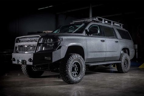 Tactical Suburban, Suburban Overland Vehicle, Overland Suburban, Tactical Truck Ideas, Custom Truck Bumpers, Marine Special Forces, Truck Roof Rack, Tactical Vehicle, Apocalypse Stuff