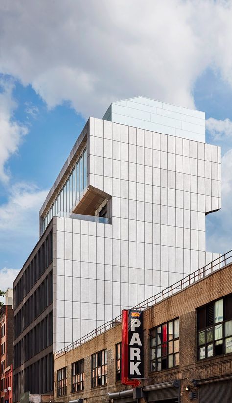 Five of the eight storeys are held in a chunky box with a gridded facade. The upper levels step back, forming a crown of sorts with a tall glazed wall. Lisson Gallery, Facade Panel, Volcanic Stone, Grey Metal, Polished Concrete, Exhibition Space, Clean Energy, Urban Life, Contemporary Art Gallery