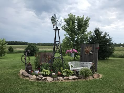 Small Windmill Yard Decor, Decorative Yard Windmills, Landscaping Around Windmill, Rustic Flower Beds In Front Of House Country Decor, Front Yard Landscaping Rustic, Landscaping With Old Farm Equipment, Front Yard Landscaping Country, Yard Windmill Garden Art, Windmill Yard Landscaping