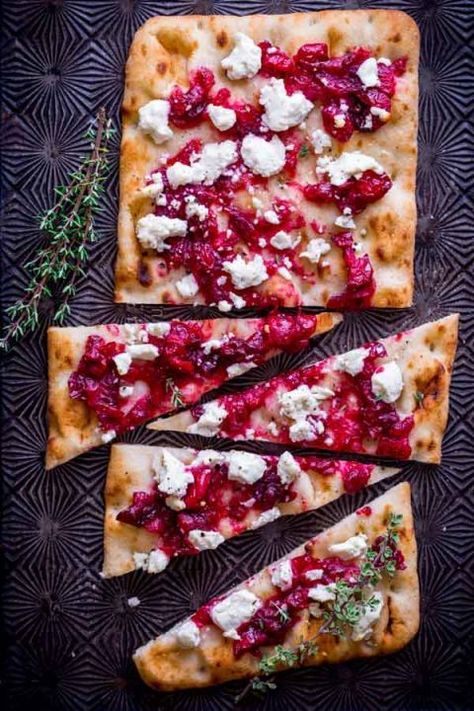 Roasted Cranberry and Goat Cheese Flatbread Recipe: With cranberry and goat cheese flavors baked on a toasted flatbread, this is the most festive—and addicting—starter to your holiday celebration. Appetizer Flatbread, Christmas Snacks Savory, Goat Cheese Flatbread, Goats Cheese Flatbread, Flatbread Pizzas, New Year's Eve Appetizers, Appetizers Christmas, Cheese Flatbread, Festive Appetizers