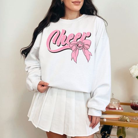 Women's Cheer Coquette Bow Graphic On Long Sleeve White Crewneck Sweater. Made From Jerzees Or Gildan 18000 Unisex Sweatshirts. Can Also Make In Sizes Small, Medium, Large, Xl, 2x. Cheerleading Gifts Cheer Season Cheerleader Sweatshirt Cheer Coquette Cheer Mom Cheer Mama Cheer Coach Cheer Sweaters, Black Panther Hoodie, Cheer Season, Cheer Tops, New Preppy, Coach Outfits, Bow Graphic, Cheer Ideas, Cheer Mom Shirts