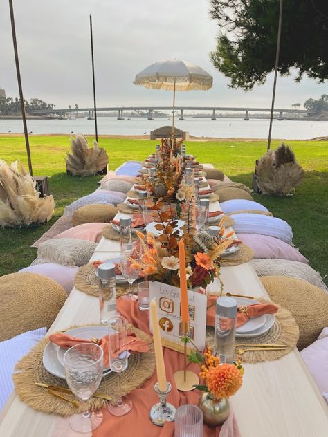 A radiant twist on rustic orange, a blush-kissed terracotta Picnic Themes, Orange Picnic, Peach Terracotta, Picnic Company, Pouf Seating, Picnic Setup, Indoor Picnic, Giant Jenga, Luxury Picnic