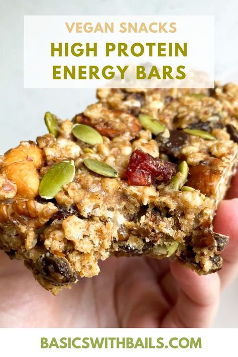 These Gluten Free Vegan Protein Bars are one of the best homemade protein bars with clean ingredients. Made with plant-based protein, healthy fats, real dark chocolate and other simple ingredients, they are perfect for a busy day. Get the full recipe at basicswithbails.com. Protein Snacks | Gluten Free Snacks | Vegan Snacks | Protein Bar Ideas | Easy Snack Recipes | Protein Bar Recipe Healthy, Protein Bars Vegan, Homemade Protein Bars Healthy, Vegan Protein Bar, Bars Recipes Healthy, Protein Energy Bars, Protein Vegan Meals, High Protein Vegan Meals, Snack Food Recipes