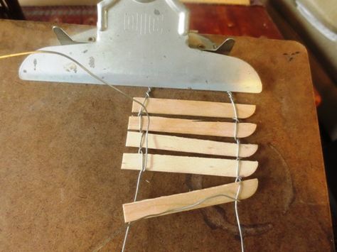 Making a picket fence:20-22 gauge craft wire Popsicle sticks or twigs Needle nosed pliers clipboard  and paint Fairy Garden Fence, Flea Market Gardening, Fairy Garden Kit, Fairy Garden Furniture, Fairy Furniture, Fairy Garden Supplies, Mini Fairy Garden, Fairy Crafts, Popsicle Stick Crafts