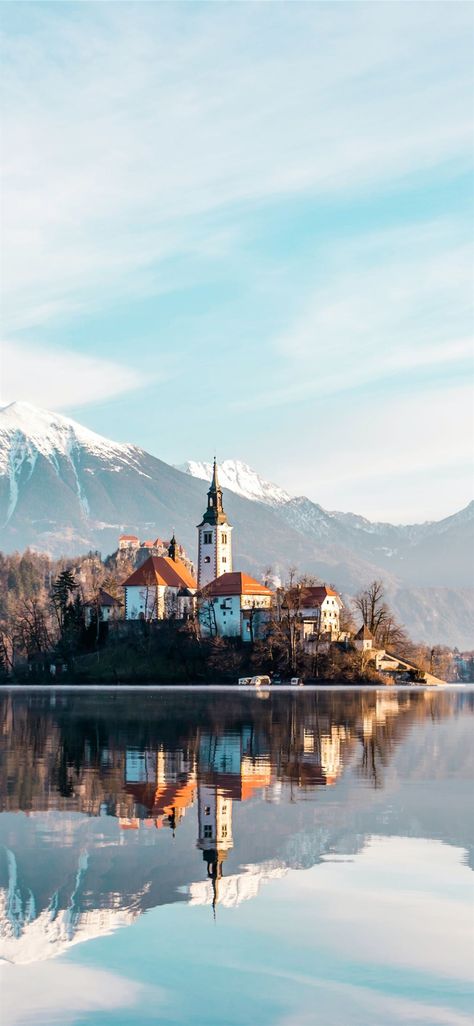 brown and white concrete building near body of wat... #nature #water #mountain #landscape #scenery #Slovenia #iPhone11Wallpaper Lake Bled Slovenia, Bled Slovenia, Slovenia Travel, Julian Alps, Lake Bled, Beautiful Lakes, Amazing Destinations, Slovenia, Day Trips