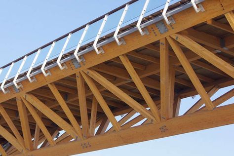 Serving as a vital link across the Enguri River to the Black Sea resort town of Anaklia, Georgia, the Anaklia-Ganmukhuri Pedestrian Bridge is considered long... Timber Bridge, Bridges Architecture, Wood Truss, Bridge Structure, Truss Bridge, Timber Architecture, Bridge Construction, Timber Buildings, Wood Building