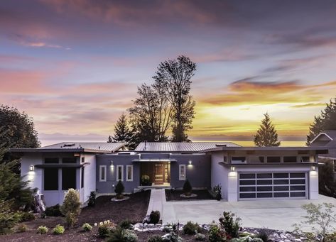 Nestled along the slopes of Kingston, Washington, with views of Puget Sound, this home has a second level that takes advantage of the sloped site. The home has 3,400 square feet of living space, including three bedrooms and a two-car garage. #dwell #prefabhomes #moderndesign #greenhomedesign Kingston Washington, Stillwater Dwellings, Green House Design, Prefab Home, Modern Prefab Homes, Midcentury Home, Puget Sound, Modular Homes, Universal Design