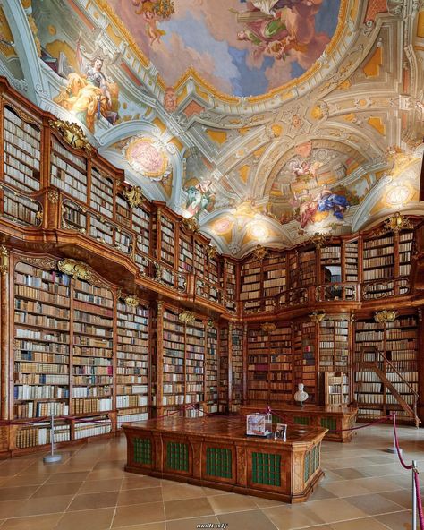 The St. Florian Monastery Library in Austria is a stunning example of late Baroque design, featuring dramatic ceiling frescoes by Austrian artist Bartolomeo Altomonte. It holds a collection of around 130,000 works, with some dating as far back as the 16th and 17th centuries.  📸: Maik Monuments Baroque Library, Old Bookshelves, St Florian, Baroque Design, Historical Books, Witchy Vibes, 17th Century, Bookshelves, Fresco