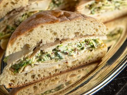 Turkey Sandwiches with Brussels Sprout Slaw Recipe | Ina Garten | Food Network Brussels Sprout Slaw, Brussel Sprout Slaw, Sandwich Vegetarian, Brussel Sprout Recipes, Barefoot Contessa Recipes, Picnic Sandwiches, Luncheon Ideas, Turkey Sandwich, Slaw Recipe