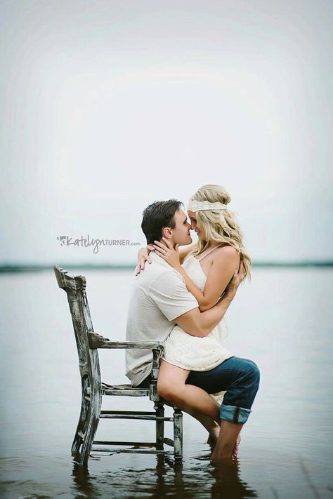 Love this old chair in shallow water couple photography, I could see this for a senior as well. Couples Photoshoot With Chair, Chair Couple Pose, Couple Poses With Chair, Chair In Water Photoshoot, Couple Chair Poses, Couple Sitting Poses On Chair, Throne Photoshoot, Secret Couple Poses, Poses Chair