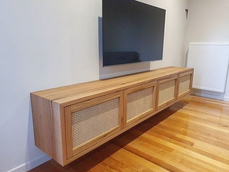 Kmart Rattan Tv Unit Hack, Rattan Tv Unit, Hanging Tv On Wall, Moody Living Room, Rattan Doors, Tv Cabinet Design, Behind Closed Doors, Tv Unit Design, Entertainment Room