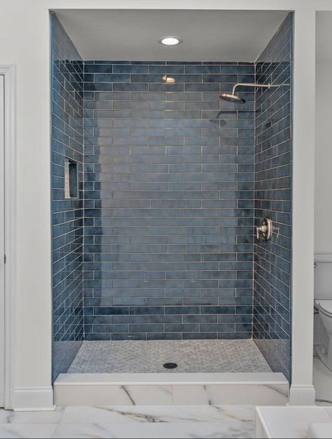 Grey Blue Shower Tile, Floor And Decor Shower Tile Ideas, Navy Shower Tile Ideas, Bathroom Light Blue Tile, Blue Tile Showers, Colorful Shower Tile Ideas, Navy Blue Shower Tile, Vertical Subway Tile Bathroom, Blue Shower Tile Ideas