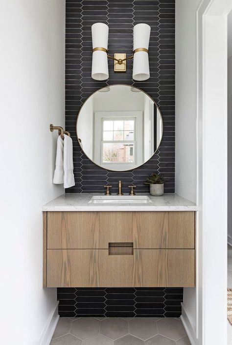 powder room with tile wall, round mirror, and floating wood vanity Floating Vanity Powder Room, Modern Half Bathroom, Small Powder Room Design, Powder Room Tile, Small Half Bathroom, Half Bath Remodel, Powder Room Vanity, Powder Room Makeover, Powder Room Design