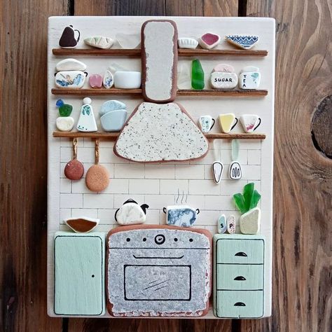 Beach finds art by Angie S. on Instagram: "I just listed this beautiful kitchen wall hanging artwork on Etsy! 😊 It's all made with sea glass, sea pottery and sea tiles on a driftwood piece painted old white. There are so many pretty details on it, such as the sea tile cooking stove and cooker hood, the sea pottery and sea glass kitchenware and the driftwood cupboards! More photos in my Etsy shop (link in bio) Have a wonderful weekend!! ❤️❤️❤️ #seaglassart #seaglasslover #seaglass #seaglassdeco Sea Tiles, Beautiful Kitchenware, Sea Glass Diy, Sea Glass Artwork, Sea Glass Decor, Sea Glass Art Diy, Sea Glass Mosaic, Sea Glass Art Projects, Have A Wonderful Weekend