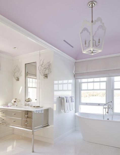 Calming purple and white contemporary bathroom boasts a freestanding tub placed… Elderly Bathroom, Paint Ceiling, Lavender Bathroom, The Sistine Chapel, Silver Bathroom, Purple Bathrooms, Bathroom Paint, Bathroom Diy, Colored Ceiling