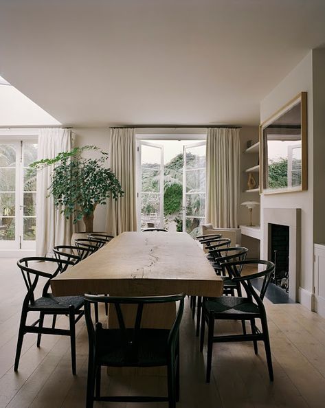 light wood live edge dining table with black thonet chairs, floor to ceiling neutral curtains with black curtain rods, indoor tree // fort & field Hill Villa, Rose Uniacke, Timeless Interiors, London Flat, London House, Dining Room Inspiration, Oak Table, Interiors Design, Stunning Interiors