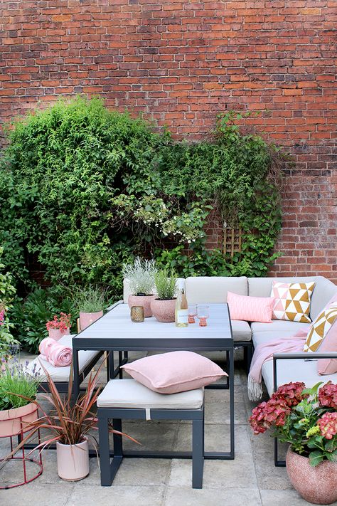 outdoor dining table with brick wall behind styled with pink and peach colours Rustic Fall Porch, Crittal Windows, Outdoor Play Areas, Raised Planter, Fall Decorations Porch, Back Gardens, Fall Porch, Easy Garden, Courtyard Garden