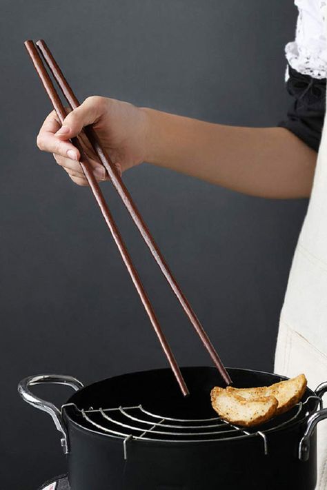 Giant cooking chopsticks for deep frying, stir frying, boiling, steaming, flipping, stirring, scooping, serving, wizards, and grabbing things from a distance. Cooking Chopsticks, Cool Stuff To Buy, Camping Pot, Baking Gadgets, Stuff To Buy, Bread Oven, Silicone Chocolate Molds, Baking Games, Sliced Baguette