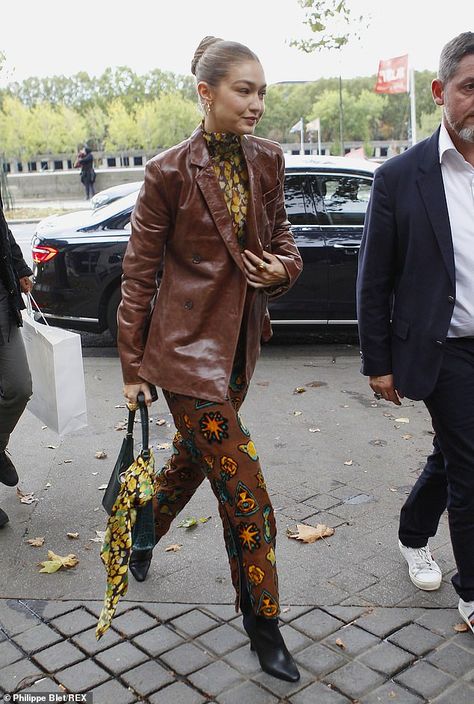 Gigi Hadid channels '70s chic in flares and a brown leather jacket during Paris Fashion Week | Daily Mail Online Supermodel Street Style, Leather Jacket Street Style, Brown Leather Blazer, Coloured Leather Jacket, Brown Leather Coat, Tan Leather Jackets, Fashion Week Spring 2020, Winter Closet, Leather Jacket Outfits