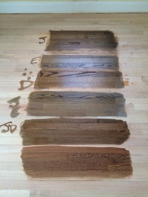 Minwax Color Guide. Stain samples on a white oak floor. From top: Jacobean, Ebony, Dark Walnut, 50/50 Jacobean and Ebony, 50/50 Jacobean and Dark Walnut, and English Chestnut at the bottom. We went with 50/50 Jacobean and Dark Walnut and love it! It's hard to describe colors, but if I worked for Miniwax Color Naming Dept., I would call it Pecan. Hardwood Floor Stain Colors, Oak Floor Stains, Floor Stain Colors, Wood Floor Stain Colors, Wood Floor Colors, Red Oak Floors, Grey Stained Wood, Hardwood Floor Colors, White Oak Hardwood Floors