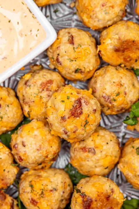 Crack Chicken Meatballs Recipe - the best chicken meatball recipe! Made with ground chicken, ranch dressing mix, cheddar cheese, and crispy bacon; these meatballs are comfort food at its finest. Baked to perfection, they're perfect for parties, appetizers, or a hearty meal. Cheesy Chicken Balls, Ground Chicken Appetizers, Cheddar Meatballs, Chicken Meatball Recipe, Garlic Butter Rice, Chicken Meatballs Recipe, Chicken Dressing, Chicken Meatball, Slow Cooker Casserole