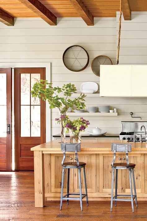 Open Kitchen with Shiplap Walls - 15 Ways with Shiplap - Southernliving. Tailored shiplap walls made of paint-grade wood contrast with the rough-hewn floors and ceiling. The wall’s subtle hue (Lambswool by Pratt Shiplap Kitchen, Painting Shiplap, Installing Shiplap, Southern Living Magazine, Industrial Kitchen Design, White Shiplap Wall, Young House Love, White Shiplap, Style Deco