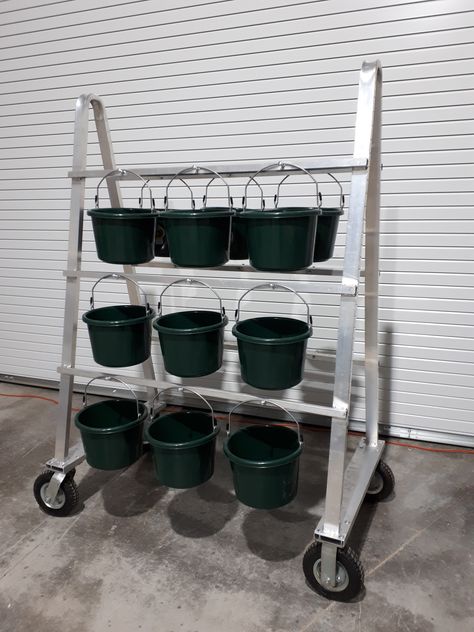 18 bucket Feed Cart made of aluminum. Will never rust. Saves time when feeding a large number of horses! Feed Buckets Horses, Horse Feeding Buckets, Feeding Room Horse, Horse Feed Bucket, Feed Room Organization, Feed Room Ideas Barn, Horse Feed Storage, Horse Feed Room, Show Cattle Barn