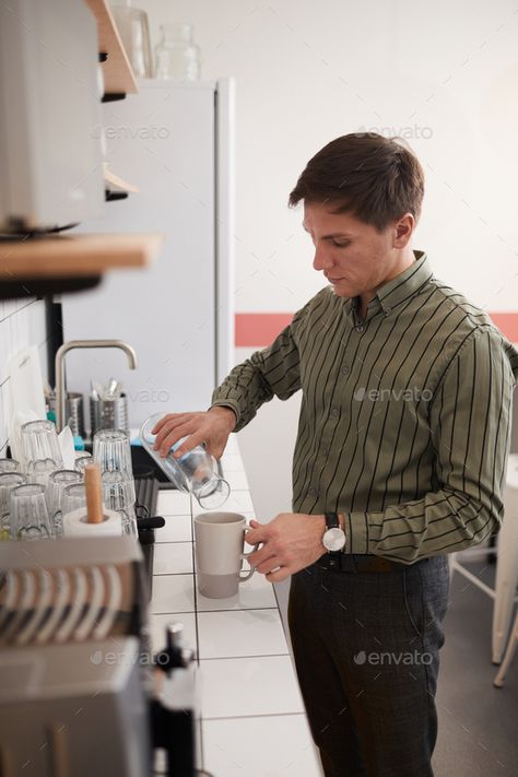 Man drinking coffee by AnnaStills. Young businessman standing in the kitchen at office and pouring the water into his cup #AD #AnnaStills, #Young, #businessman, #Man Barista Man, Pouring Coffee, Barista Training, Coffee Counter, Coffee Brewing Methods, Person Portrait, Aeropress Coffee, Barista Coffee, Training Ideas